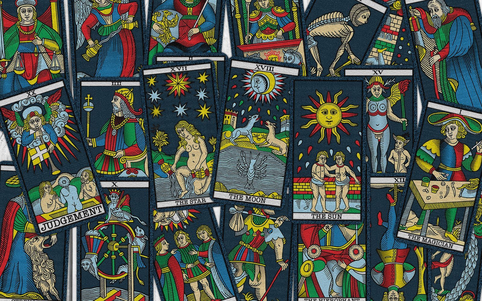 Tarot cards scattered together, including The Star, The Moon, The Sun and Judgement