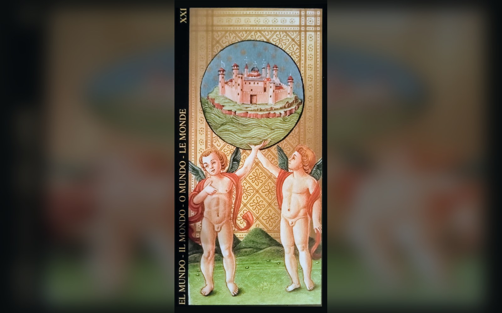 Two winged cherubs support a circular medallion of a walled city on the World tarot card